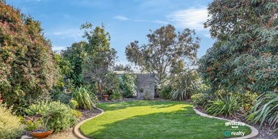 A spacious, landscaped garden offers a perfect outdoor retreat with abundant greenery and peaceful surroundings.