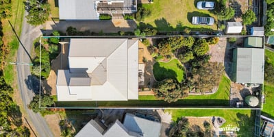 Spacious property featuring a sprawling yard, ideal for outdoor activities and potential landscaping projects.