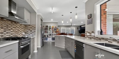Modern kitchen featuring sleek cabinetry, a spacious layout, and contemporary appliances for culinary enthusiasts.