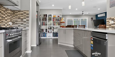 Modern kitchen featuring sleek cabinetry, stainless steel appliances, and an open layout perfect for entertaining.