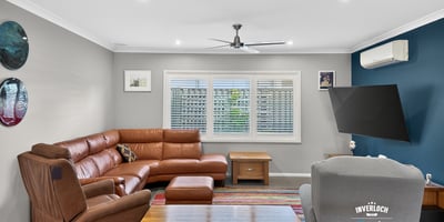 Spacious living area featuring a modern layout, comfortable seating, and abundant natural light throughout.