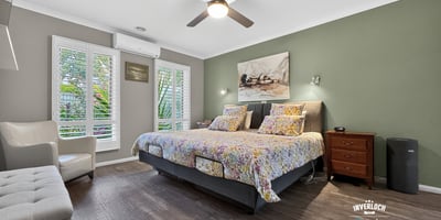 Bright and inviting bedroom featuring modern amenities and a tranquil view, perfect for relaxation.