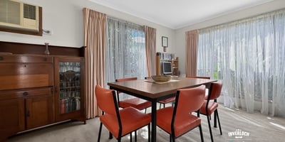 Bright and inviting dining area with ample natural light and a warm, welcoming atmosphere.