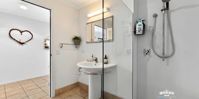 Modern bathroom featuring a spacious shower, contemporary fixtures, and a neutral color palette for a fresh feel.