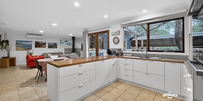 Bright and functional kitchen featuring ample counter space, modern appliances, and open access to the living area.