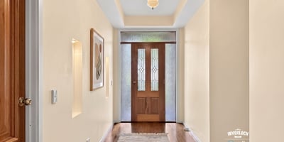 Inviting foyer with natural light, showcasing a welcoming entry that leads to the main living spaces.