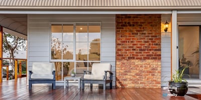 Relax on the spacious deck, featuring inviting seating and a blend of modern and classic design.