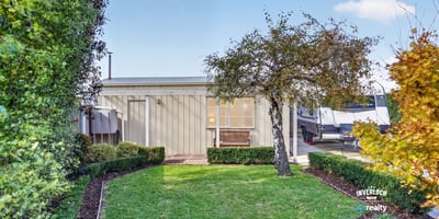This modern property features a landscaped garden and inviting outdoor space perfect for relaxation and entertainment.