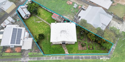 Spacious property featuring a large yard, multiple outbuildings, and convenient access to local amenities.