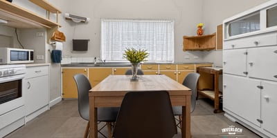 Bright and functional kitchen with modern cabinetry and ample space for dining and entertaining.