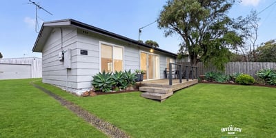 Bright and inviting home featuring a spacious yard, perfect for outdoor gatherings and relaxation.