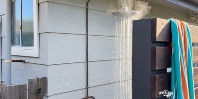 Experience outdoor living with this unique outdoor shower, perfect for refreshing after a day at the beach.
