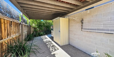 Discover a private outdoor space featuring ample shade, perfect for relaxation or entertaining.