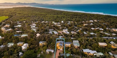 Discover a spacious home surrounded by lush landscapes, just a short stroll from beautiful coastal views.