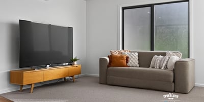 Bright and spacious living area featuring modern furnishings and large windows for ample natural light.