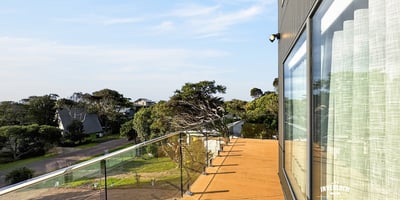Contemporary outdoor space offers panoramic views, ideal for relaxation or entertaining in a coastal setting.