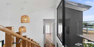 Modern open-concept design featuring natural light and unique pendant lighting, ideal for contemporary living.