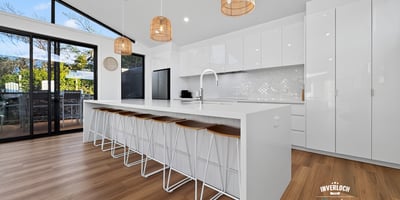 Modern kitchen featuring spacious design, sleek cabinetry, and ample natural light, perfect for entertaining.
