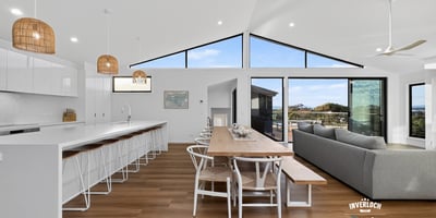 Spacious open-concept living area with modern finishes and abundant natural light, perfect for entertaining.