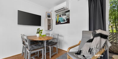 Bright and airy living space featuring a cozy dining area and modern amenities for comfortable living.