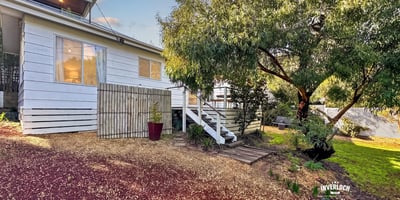 Cozy home with a spacious yard, perfect for outdoor activities and family gatherings.
