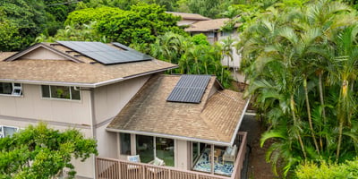 This home features solar panels and lush greenery, offering a unique blend of eco-friendliness and privacy.