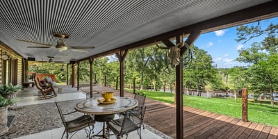 Spacious outdoor deck with panoramic views, perfect for entertaining or enjoying tranquil moments in nature.
