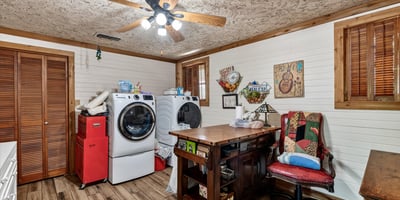 Bright laundry room features ample workspace for everyday tasks.