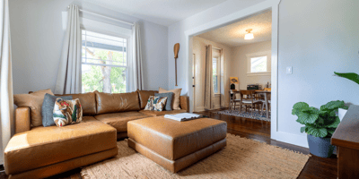 Bright and inviting living space features modern furnishings, abundant natural light, and a convenient open layout.