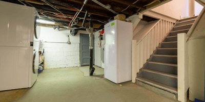 Versatile basement space featuring laundry facilities, ample storage, and easy access to upper floors.