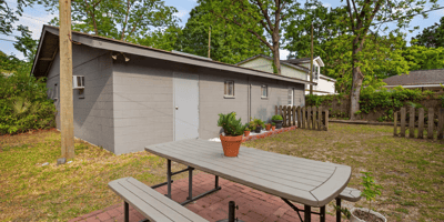 Spacious outdoor area features a picnic spot, perfect for gatherings and enjoying the natural landscape.