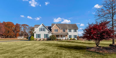 Set back from the street on 1.8 open, level-perfect acres.