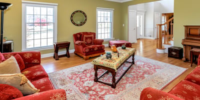 The elegant Living Room
features crown molding and hardwood flooring.