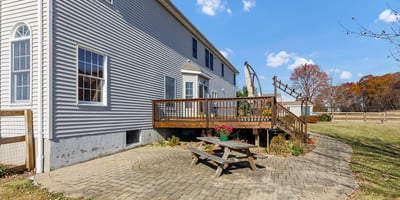 The large paver patio and deck provide lots of room for entertaining and outdoor recreation.