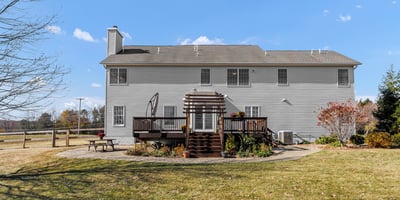 The view from the yard to the home highlights the attractive, enjoyable outdoor space.