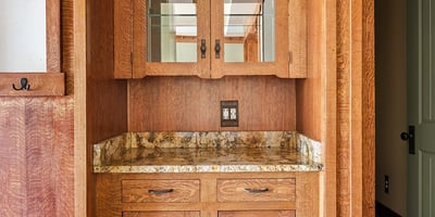 Built in wine bar with ample storage, stone countertop, and custom cabinetry. A standout entertaining feature that adds both style and function to this Phoenix home.