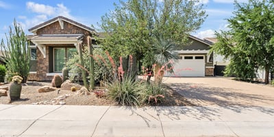 From the architectural stonework to desert garden landscaping, the front of this Phoenix home makes a warm and welcoming first impression.
