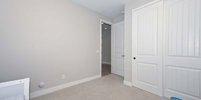 Featuring soft carpet and a large closet, this third bedroom is a blank canvas ready for personalization or practical use.