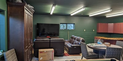 Flexible entertainment room offering space for games, seating, and social gatherings with a durable, multi-use layout.