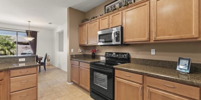 A beautiful combination of form and function, this kitchen offers plenty of prep areas and direct access to the dining and great rooms.