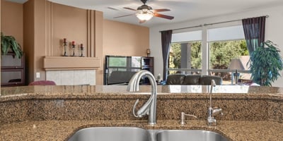 Entertain in style from this kitchen s granite island and dual sinks. The open concept keeps everyone connected and enhances flow throughout the home.