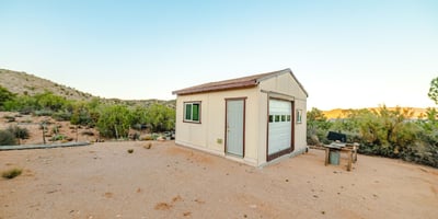 Set against acres of open land, this detached shed is perfect for workshop needs, storage, or equipment use. Its placement offers privacy and sweeping Hackberry views.