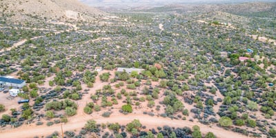 From above, the layered hills and desert shrubs frame the property beautifully, highlighting its peaceful placement within Hackberry s natural landscape. A true retreat for nature lovers