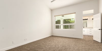 Spacious primary bedroom with high ceilings, plush carpet, and generous natural light. The peaceful Scottsdale setting offers a relaxing retreat with easy access to the updated ensuite bathroom.