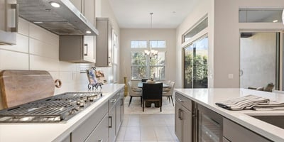 Open kitchen layout connecting effortlessly to dining and living areas, maximizing space, light, and functionality for modern lifestyles.