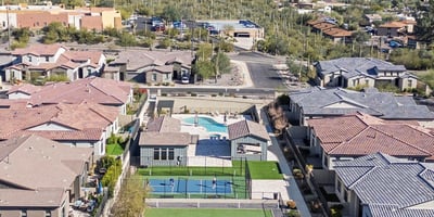 Scenic overview of shared community amenities surrounded by desert landscaping and mountain views, enhancing the neighborhood lifestyle.