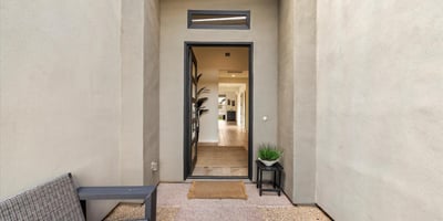 Private courtyard entrance offering a tranquil welcome with modern finishes and desert charm. A stylish introduction to this Scottsdale luxury residence.