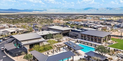 Bird s-eye view of the community amenities featuring resort-style pools, shaded seating areas, and contemporary Scottsdale design elements.