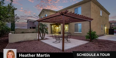 A charming pergola anchors the backyard, providing shaded seating ideal for entertaining. This Glendale home combines low-care landscaping with stylish outdoor living space.