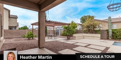 The covered patio overlooks the pergola and pool area, offering a seamless extension of indoor living. This Glendale home highlights energy efficiency, outdoor upgrades, and inviting entertaining spaces.